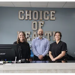 Chiropractor Overland KS Richard Snow With Staff